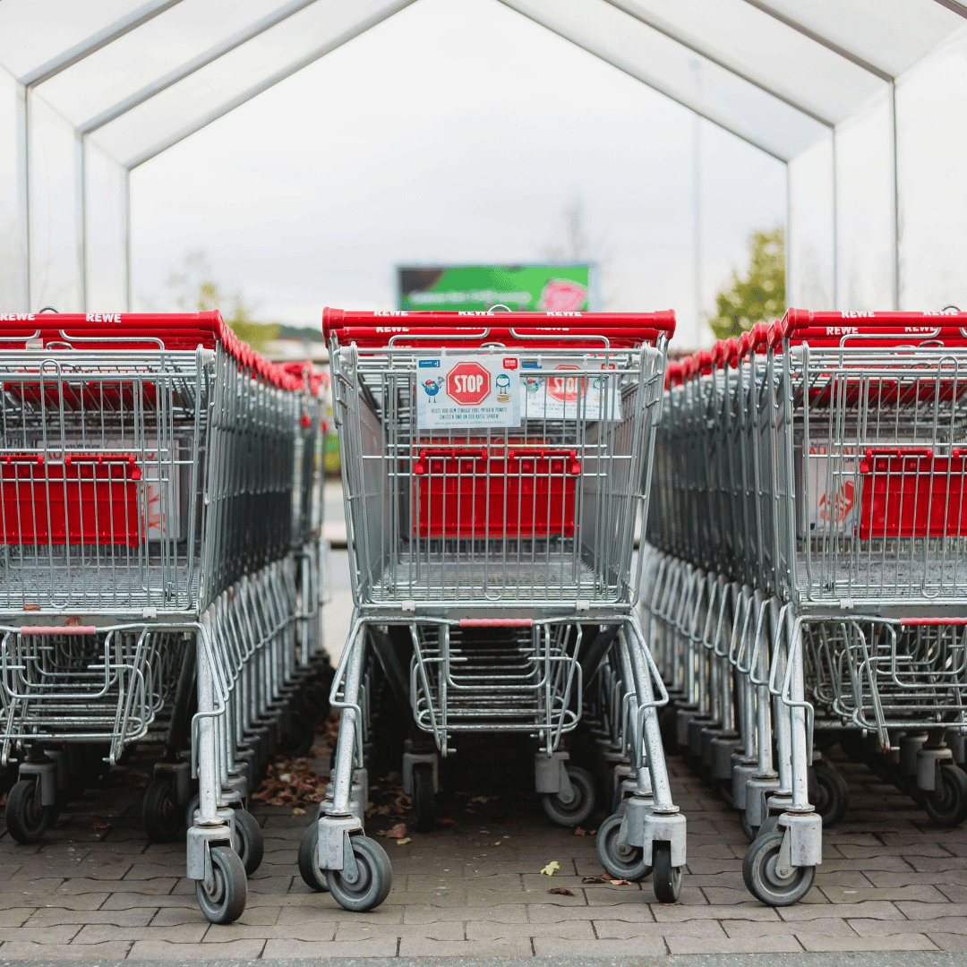 three stacks of supermarket trolleys